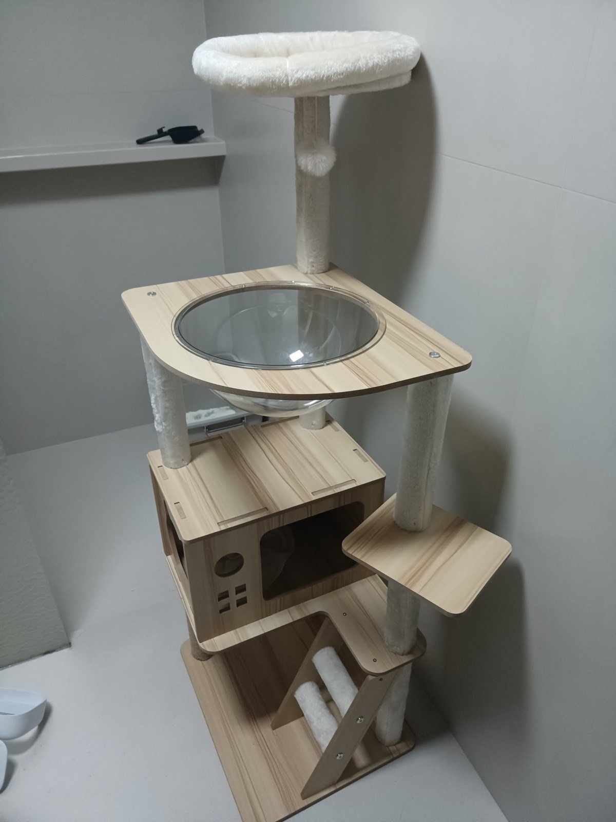 Wooden cat tree with clear bowl and enclosed cat house