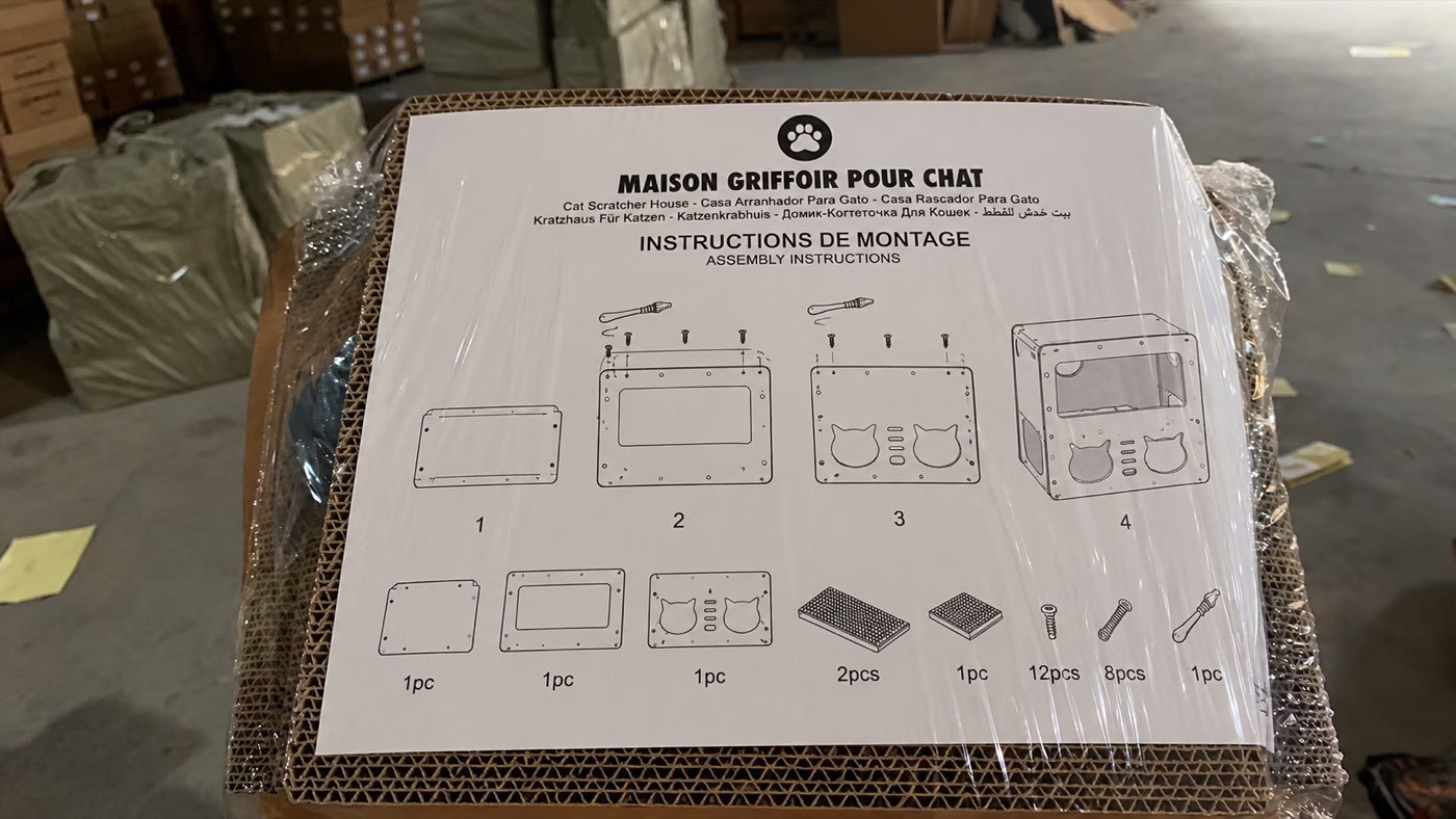 Packaged corrugated cat house with assembly instructions and component diagrams
